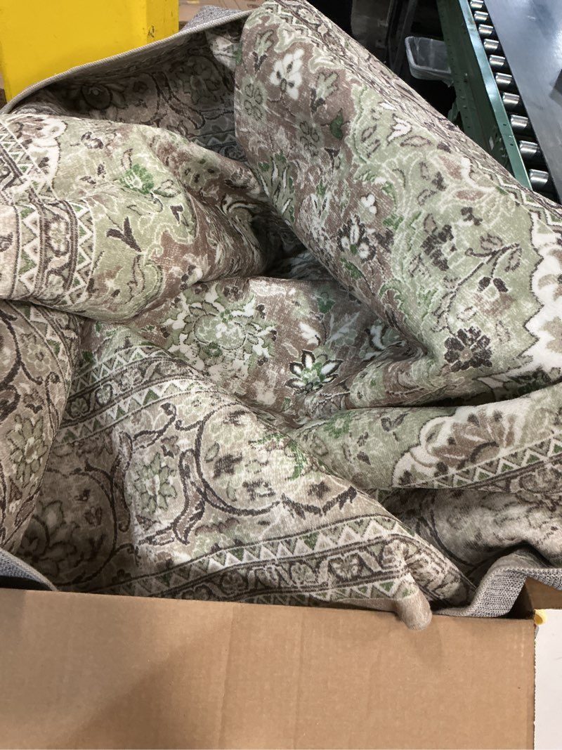 Condition photo showing Good Condition for area rug featuring a traditional vintage-style floral medallion pattern.  (Unknown size)(similar to stock photo)