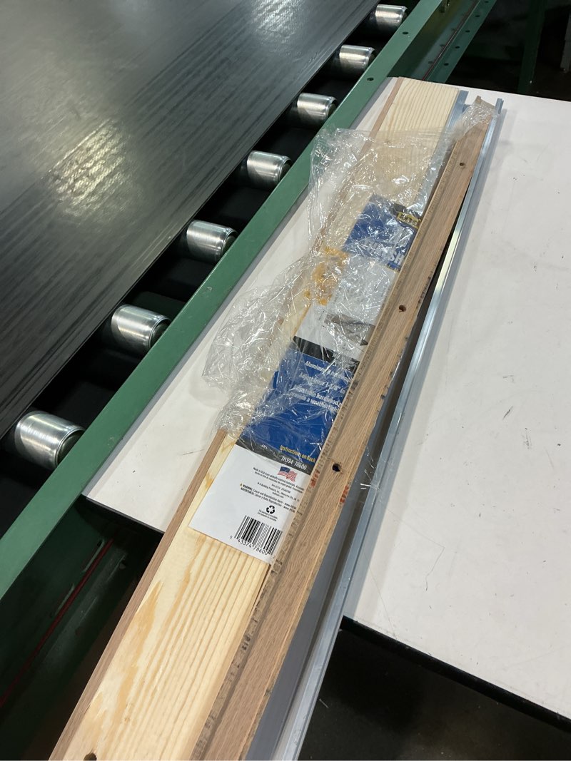 Condition photo showing As Is for m-d building products 1.13 in. h x 5.63 in. w x 36 in. l aluminum adjustable threshold oak