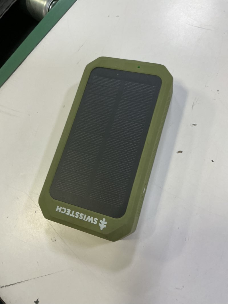Condition photo showing As Is for swiss tech 20000mah wireless power bank with flashlight and ip54 protection
