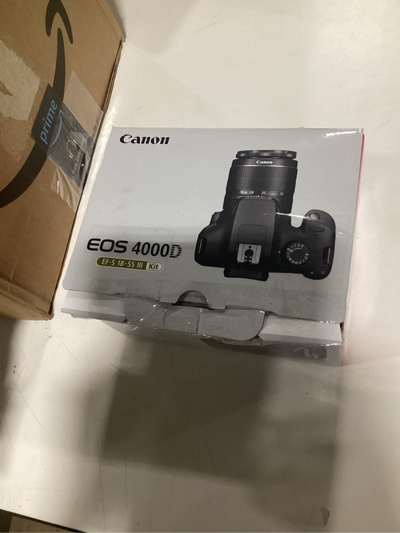 Condition photo showing As Is for canon eos 4000d / rebel t100 dslr camera w/ef-s 18-55mm f/3.5-5.6 lens 3 lens kit bundled with 128gb memory + wide angle lens + telephoto lens + flash + more (renewed) black