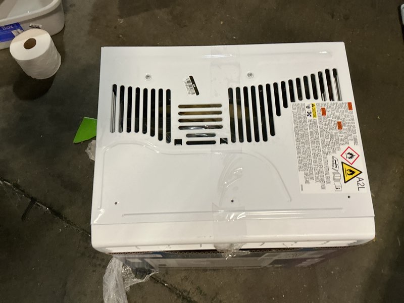 Condition photo showing As Is for ge appliances 6000 btu electronic window air conditioner unit