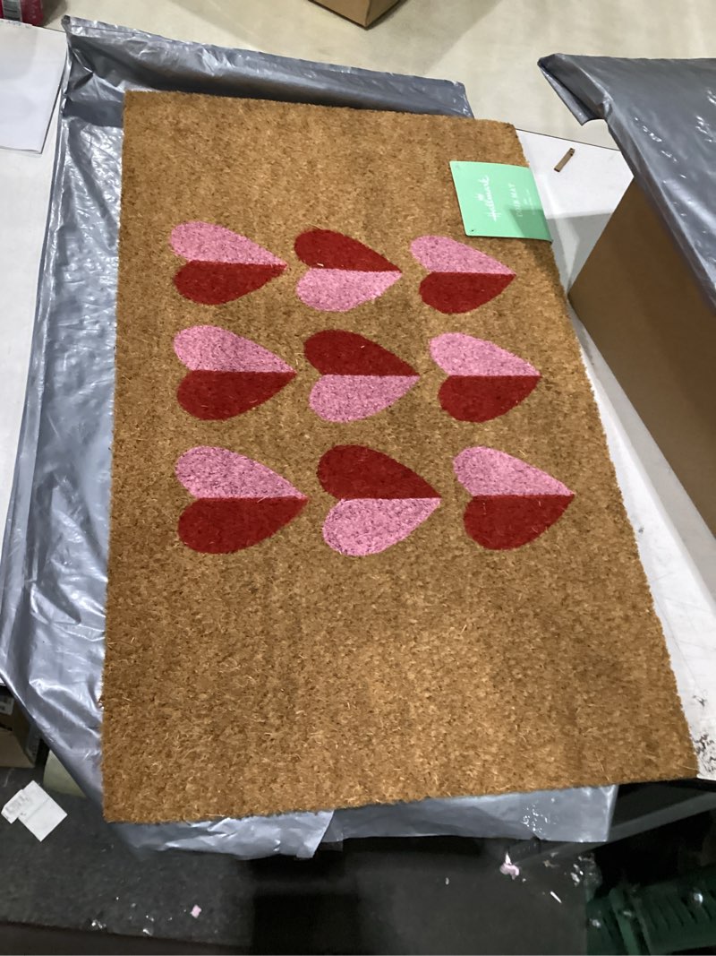 Condition photo showing New/Like New for hallmark - doormat, outdoor coir welcome mat for front door (red heart, 18" x 30") red heart 1'6" x 2'6" (rectangular)