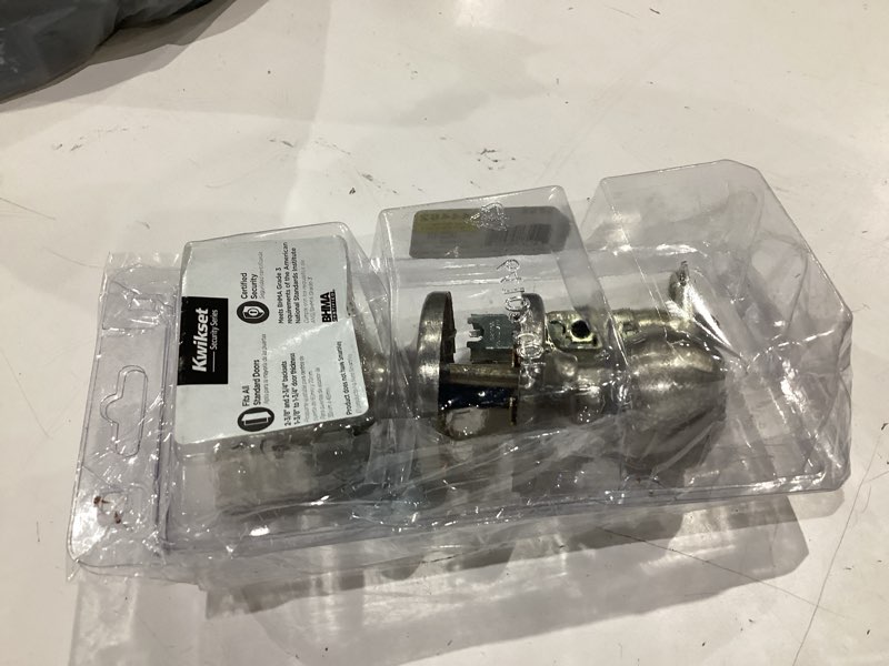 Condition photo showing As Is for kwikset polo satin nickel entry door knob 1-3/4 in.