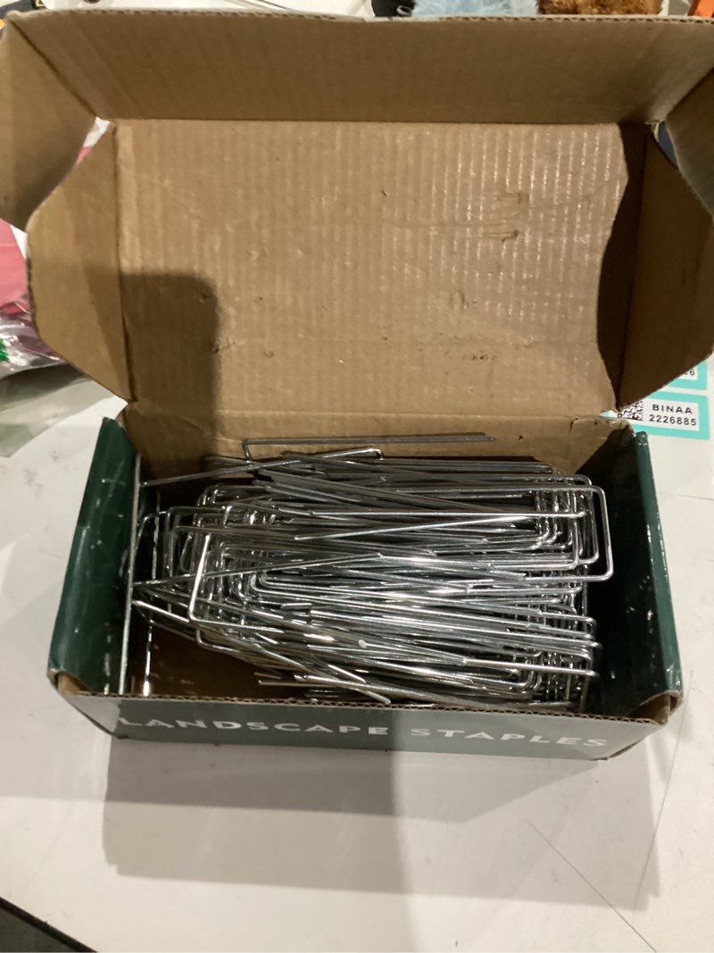 Condition photo showing As Is for 200 Pack Landscape Staples 4 Inch 12 Gauge Garden Stakes Galvanized Garden Staples Ground Pins Anti-Rust Ground Stakes for Weed Barrier, Irrigation Tubing, Yard Lawn, Landscape Fabric 4 inch 200 Pack
