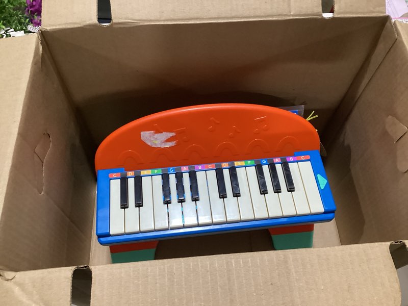 Condition photo showing As Is for battat mini musician's piano with color-coded keys and music, toddler and preschool toys