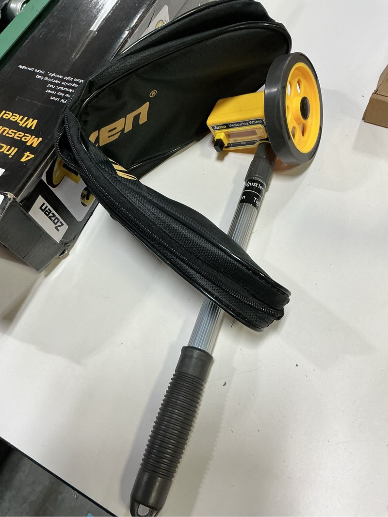 Condition photo showing Good Condition for zozen measuring wheel in feet and inches, scalable length 40in, 4-inch measure wheel, walking measurement up to 10,000ft / mechanical/one key to reset, include carrying bag.