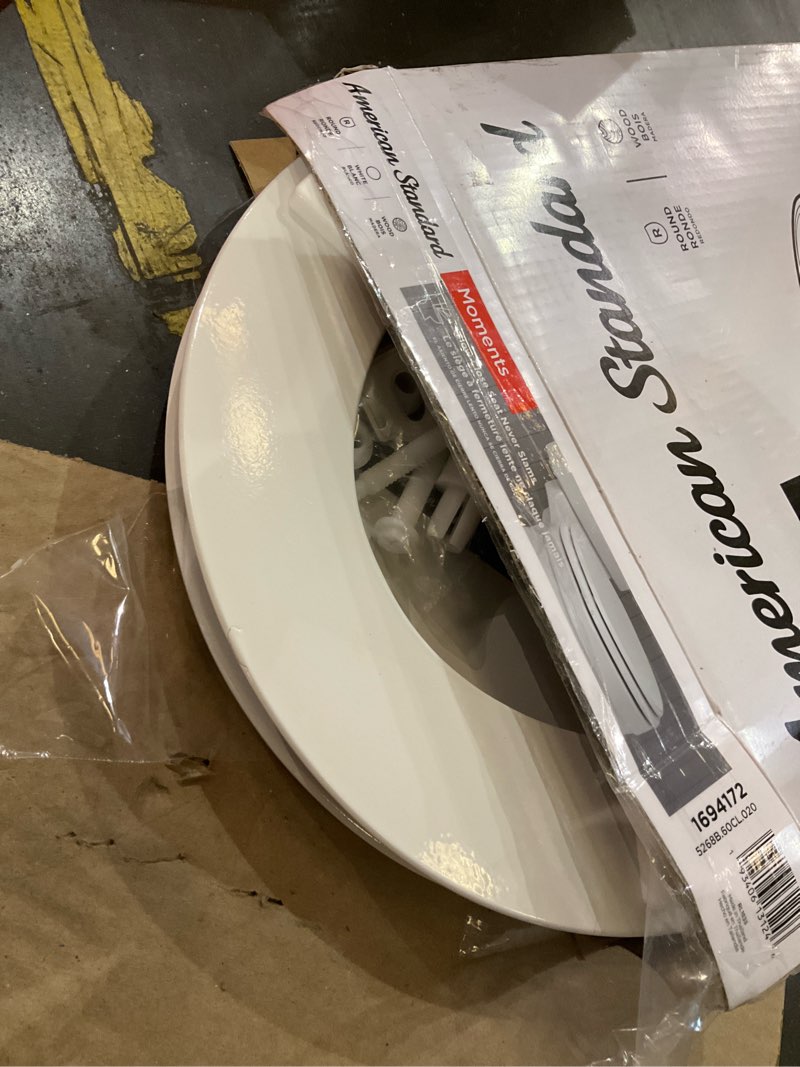 Condition photo showing As Is for american standard moments wood white round soft close toilet seat