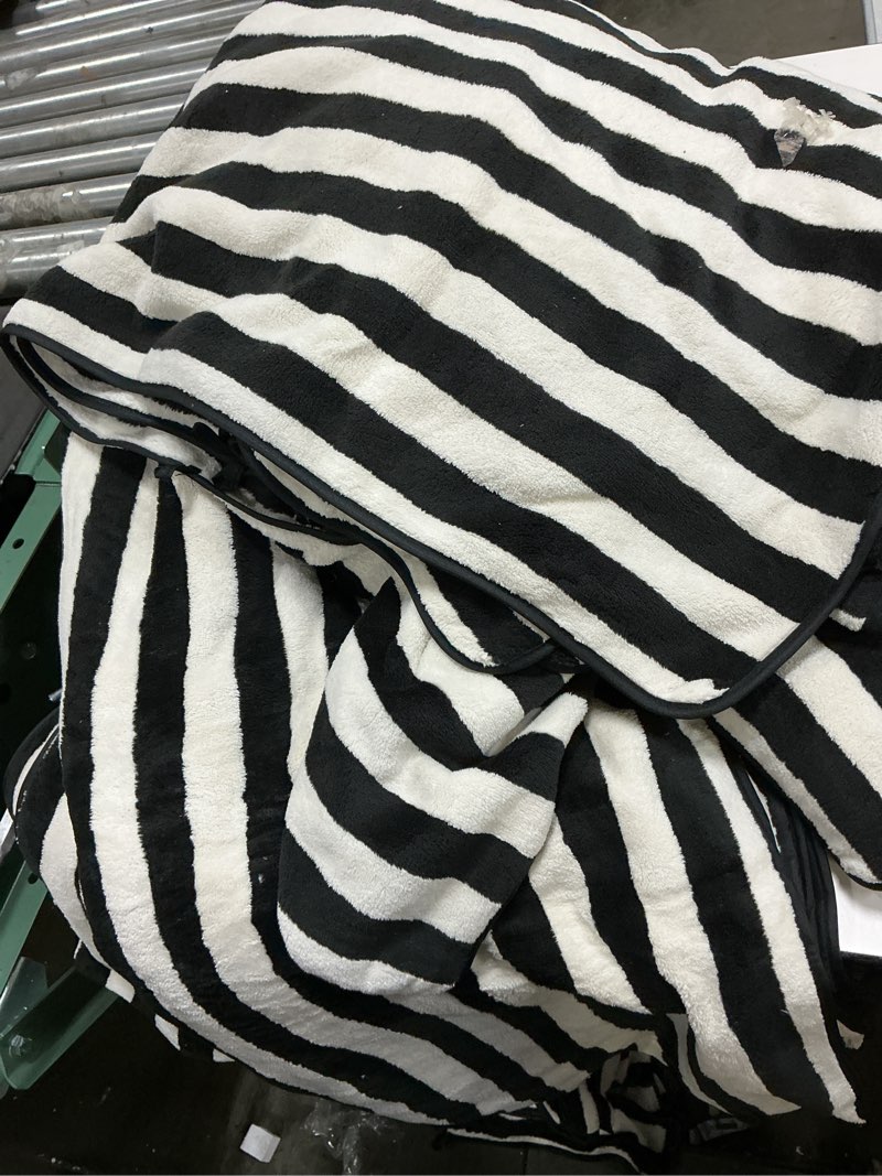 Condition photo showing As Is for bath towel black and white 28*60 pack 12