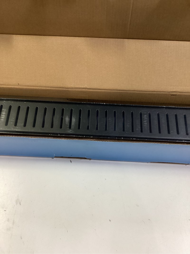 Condition photo showing New/Like New for SaniteModar Linear Shower Drain, 24 inch Matte Black Shower Drain with Removable Capsule Pattern Grate,304 Stainless Steel Shower Drain Include Hair Strainer,Adjustable Leveling Feet