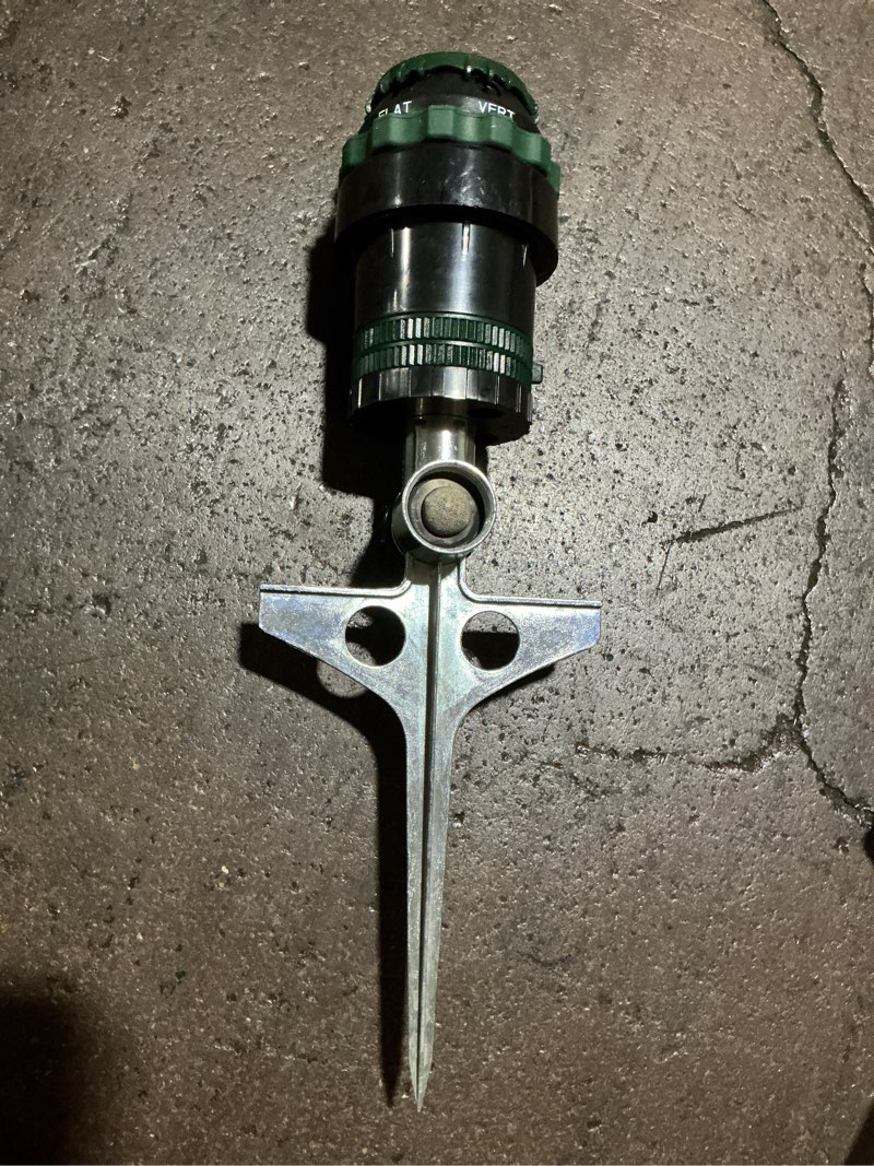 Condition photo showing As Is for h2o-six rotating 6-pattern gear-drive sprinkler on zinc spike