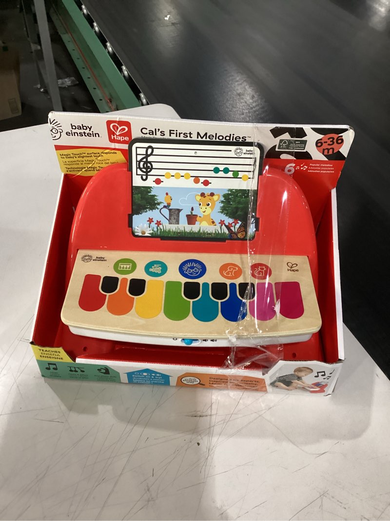 Condition photo showing New/Like New for baby einstein cal’s first melodies magic touch wooden piano musical baby toy, ages 6 months + cal’s first melodies piano