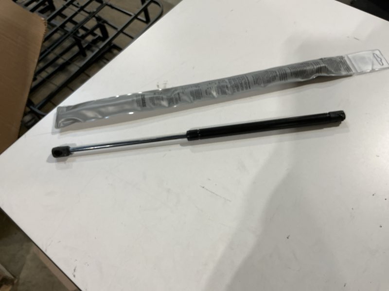 Condition photo showing Good Condition for strongarm 6939, 19.7" extended length, 105 pound force universal lift support | 19.7 inch extended, 105 lb force. strongarm gas spring, gas strut and shock - firm, lasting lift
