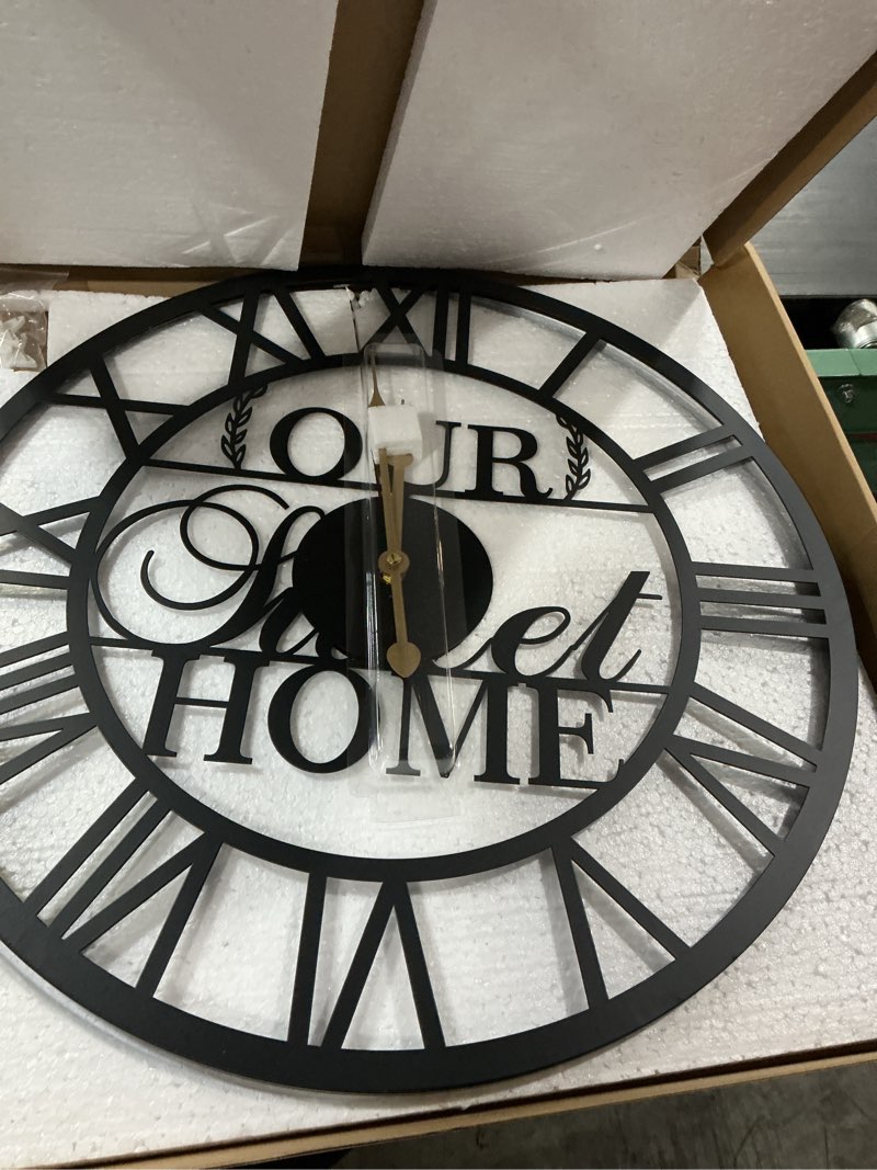 Condition photo showing New/Like New for black metal "our sweet home" roman numeral wall clock