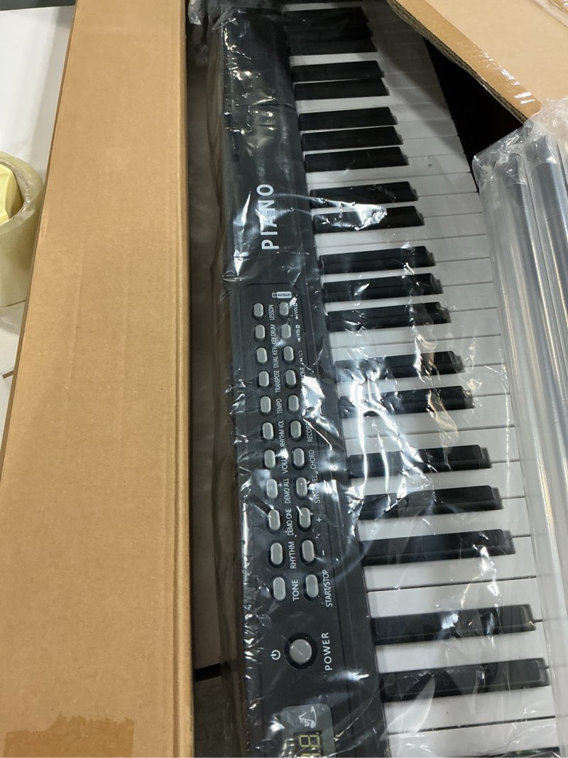 Condition photo showing New/Like New for Ktaxon Foldable Piano Keyboard 88 Key Electronic Keyboard Piano with A Portable Bag, Professional Pedal, Stereo Headphones and Smart MIDI Bluetooth Function(Black)