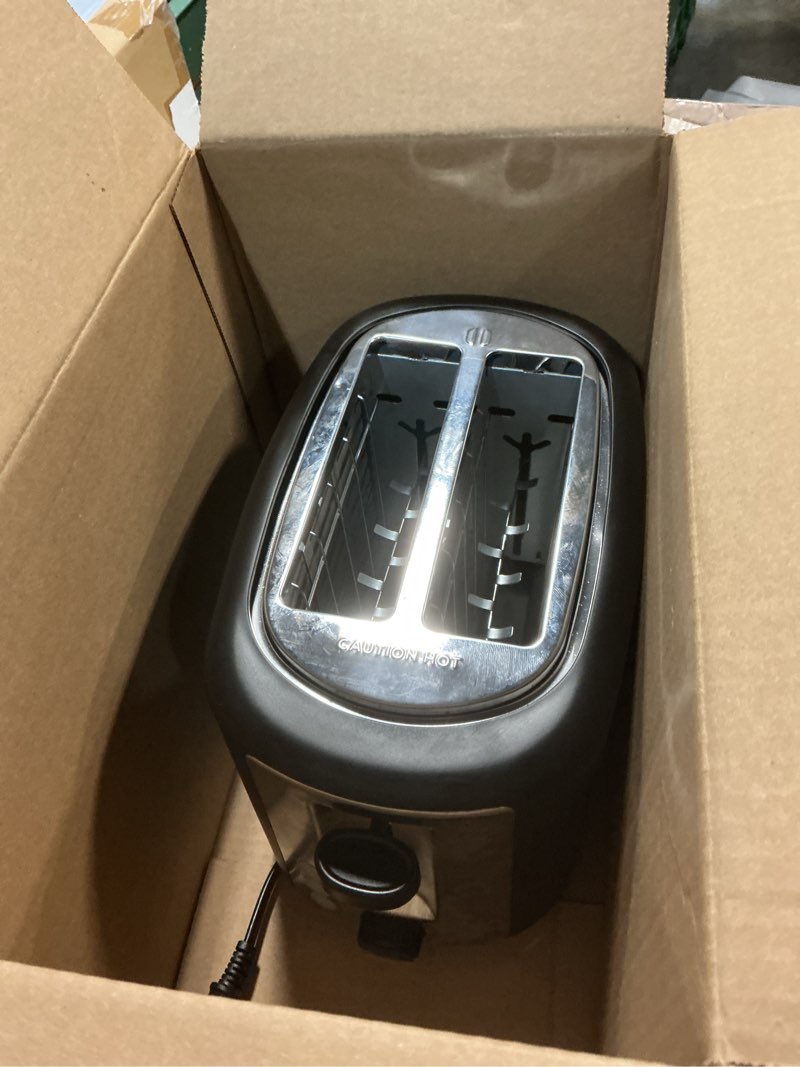 Condition photo showing As Is for Amazon Basics 2 Slice Toaster, With 6 Browning Settings, Extra Wide Slots For Bagels and Special Breads, Removable Easy-to-Clean Crumb Tray, Cancel/Defrost/Bagel Buttons, 900W, Black & Silver 2 Slice Silver Front