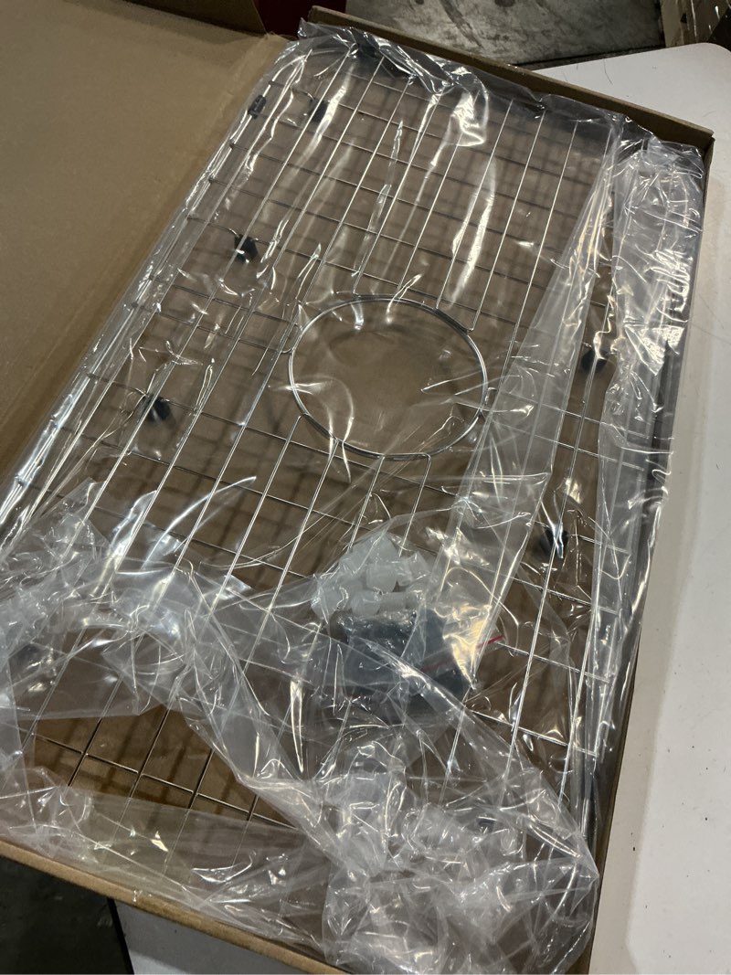 Condition photo showing Good Condition for serene valley sink protector grid 26-1/16" x 14-1/16", centered drain with corner radius 3-1/2", 304 stainless steel material nlw2614c