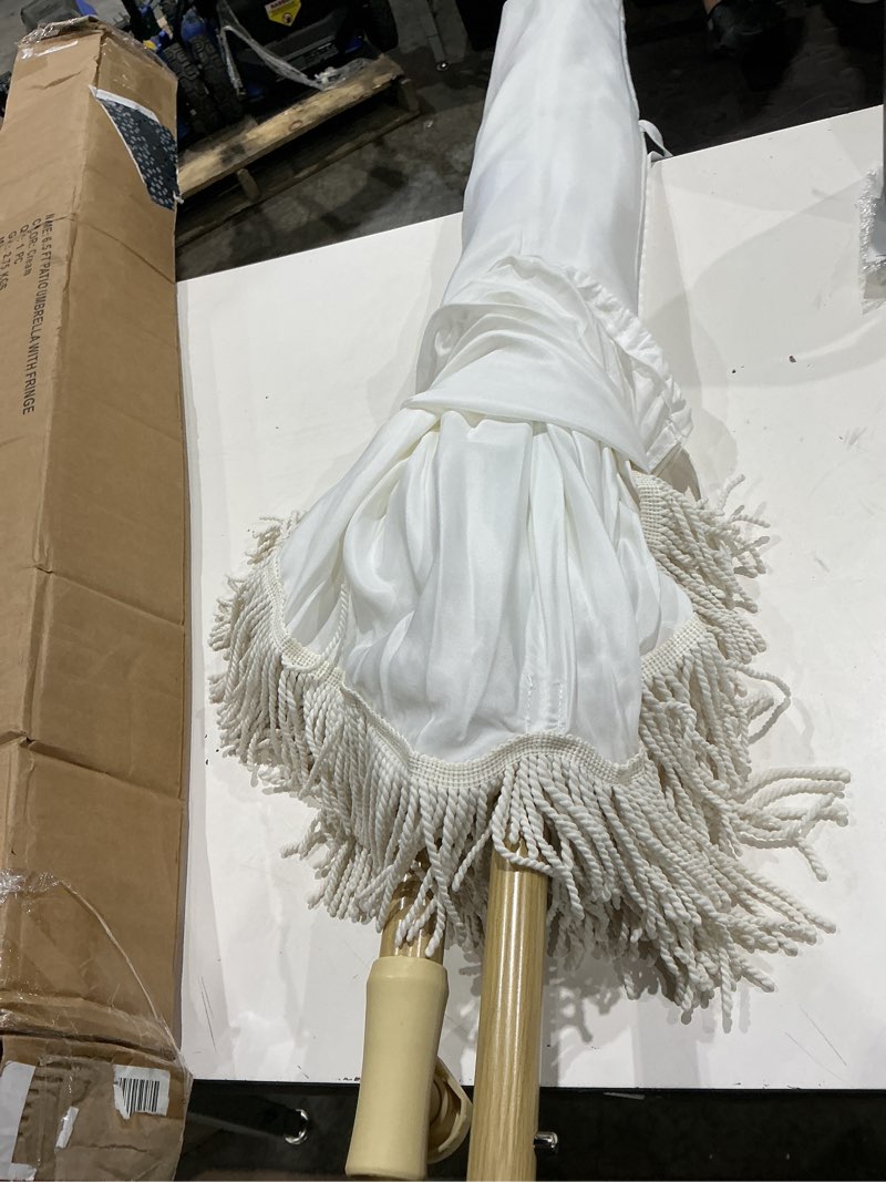 Condition photo showing Good Condition for 6.5ft patio umbrella with fringe, beach umbrella, fringe umbrella outdoor patio with hanging hook, tilting aluminum pole, uv 50+, fiberglass ribs, elegant cream