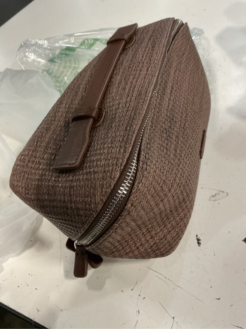 Condition photo showing Good Condition for eachy travel makeup bag, woven travel waterproof toiletry bag, portable 180° wide-open flat cosmetic bags for women, large capacity makeup pouch with divider and handle beige pu woven texture