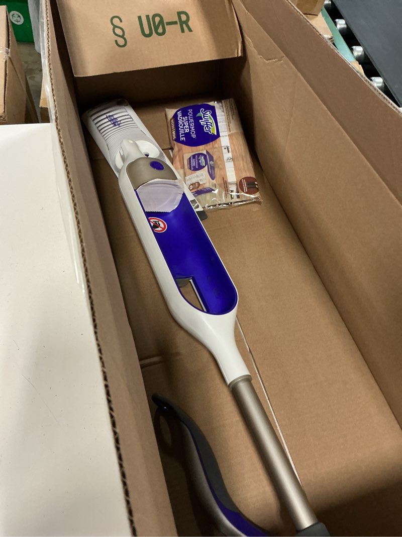 Condition photo showing As Is for swiffer powermop multi-surface mop kit for floor cleaning, fresh scent, mopping kit includes powermop, 2 mopping pad refills, 1 floor cleaning solution with fresh scent and 2 batteries purple and white