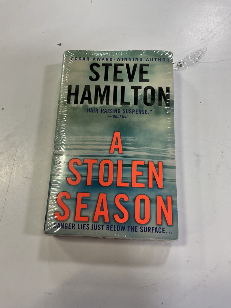 Condition photo showing New/Like New for A Stolen Season: An Alex McKnight Novel