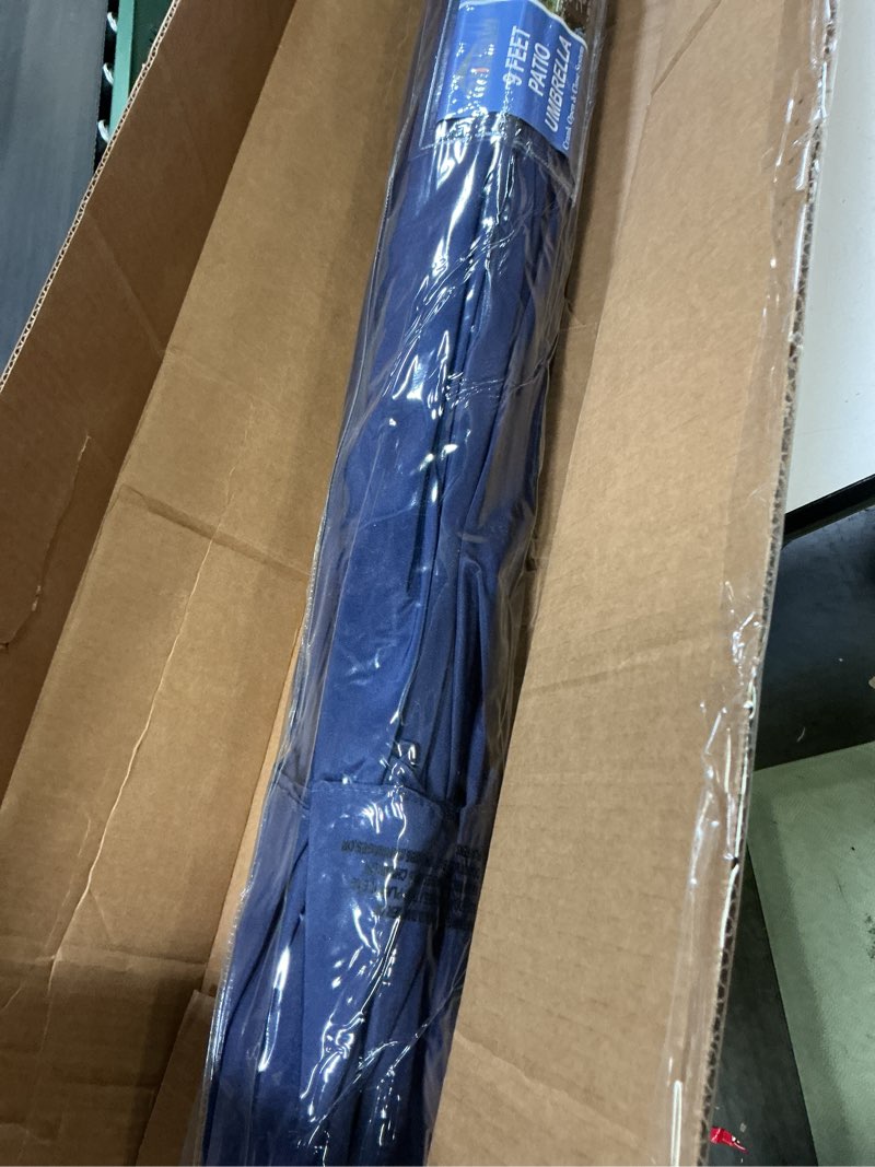 Condition photo showing Good Condition for Blissun 9' Outdoor Patio Umbrella, Outdoor Table Umbrella, Yard Umbrella, Market Umbrella with 8 Sturdy Ribs, Push Button Tilt and Crank Navy Blue