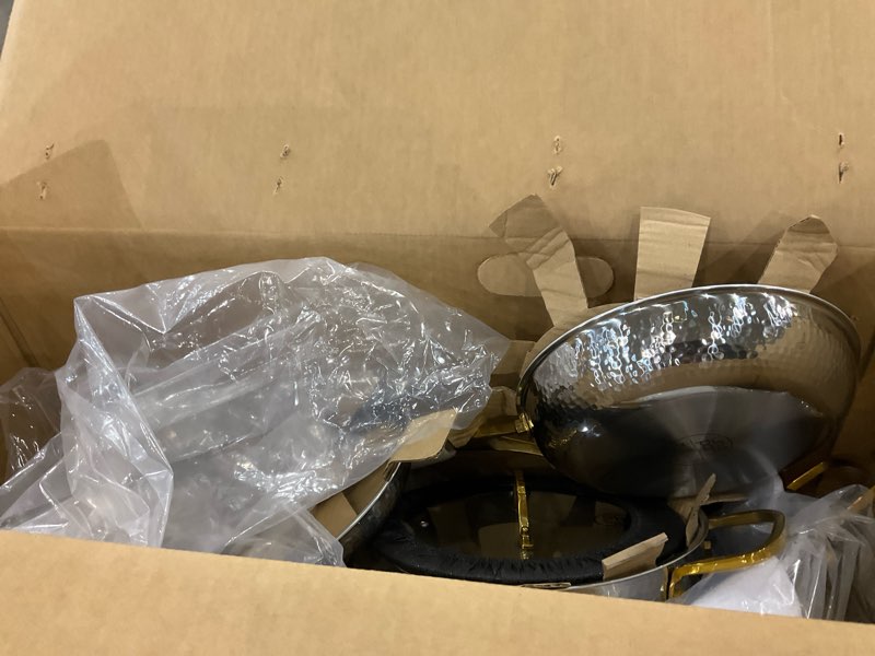 Condition photo showing As Is for Gold and black pan set 