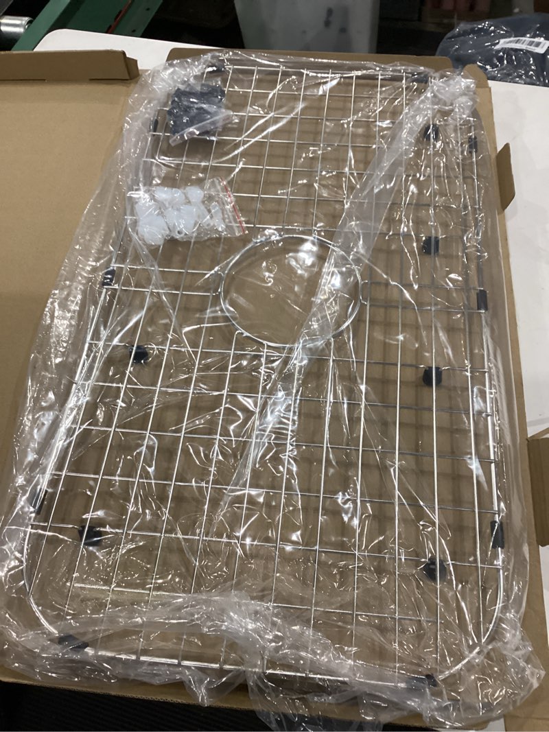 Condition photo showing Good Condition for serene valley sink protector grid 26-1/16" x 14-1/16", centered drain with corner radius 3-1/2", 304 stainless steel material nlw2614c