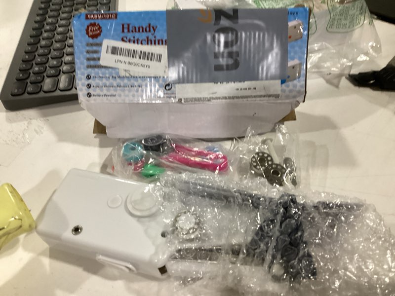Condition photo showing New/Like New for handheld sewing machine, portable and easy-to-use mini sewing machine, battery and usb operated, ideal for beginners and home use - black