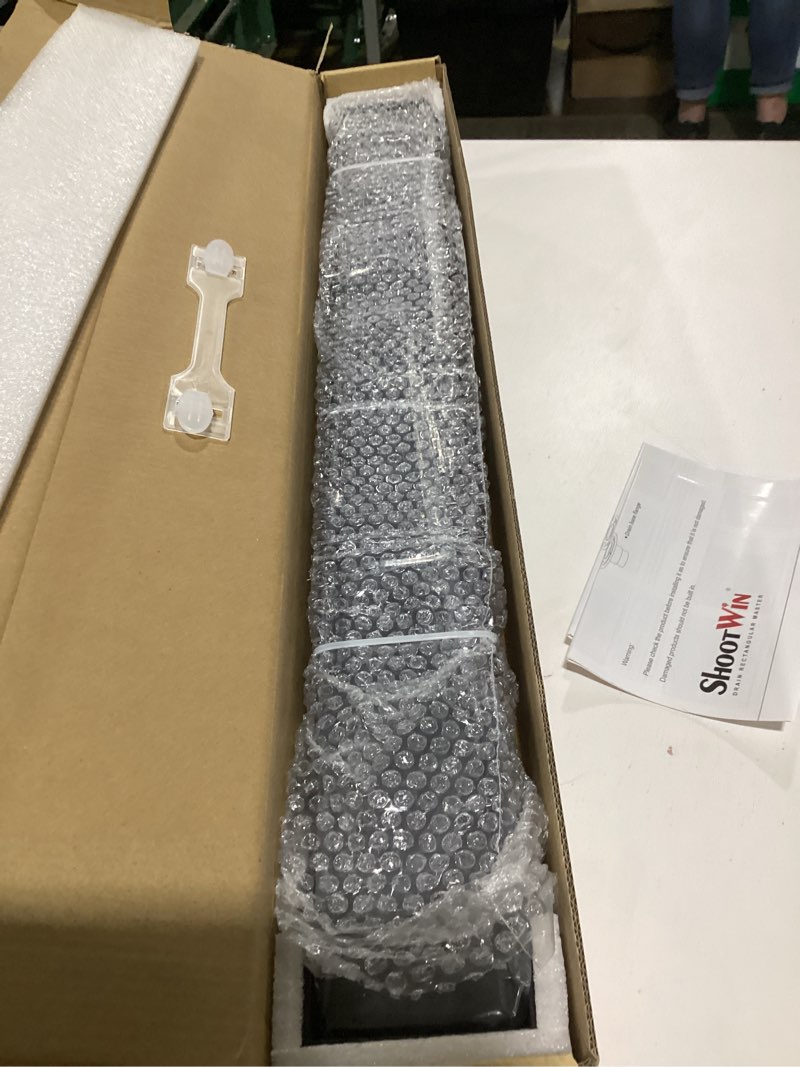 Condition photo showing Good Condition for 24-inch linear shower drain with tile insert grate, sus 304 stainless steel linear drain, matte black long rectangle shower floor drain with leveling feet, hair strainer, fits bathroom matte black 24 inch