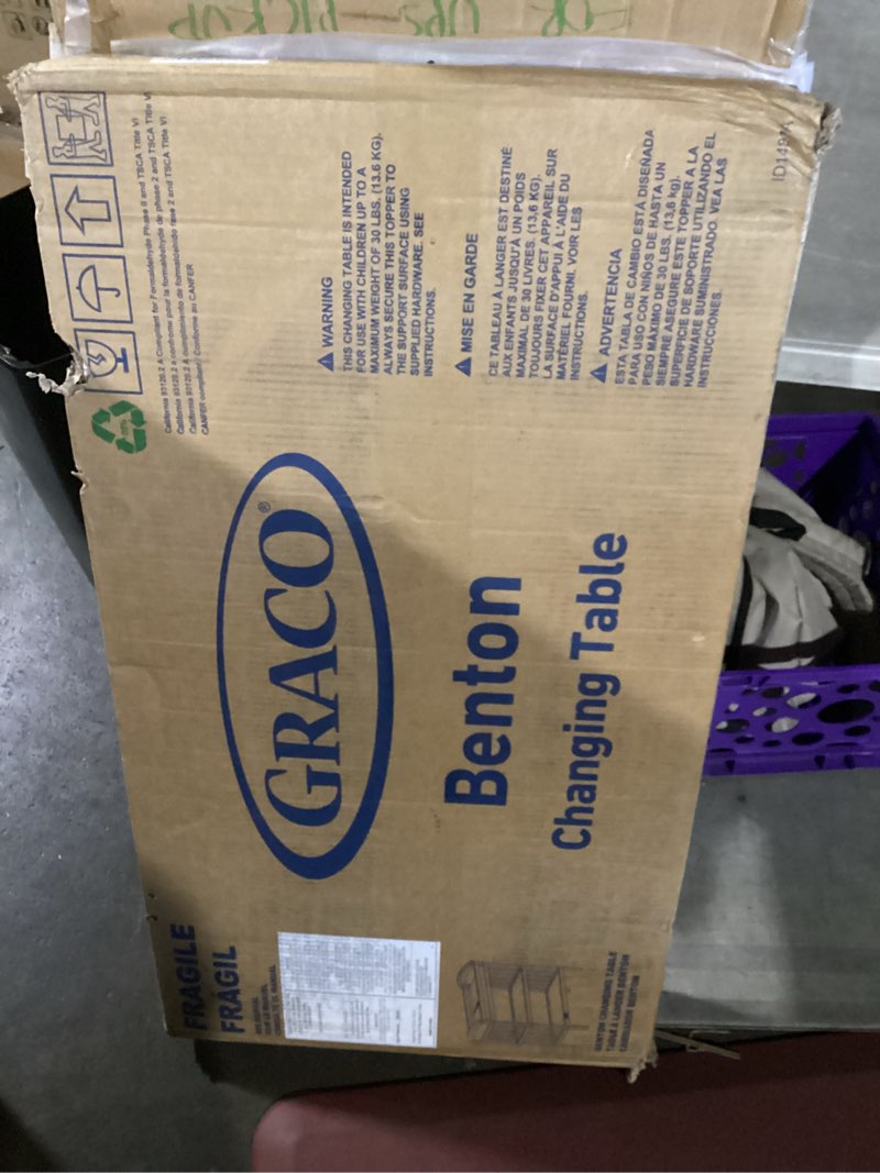 Condition photo showing New/Like New for graco benton changing table with bonus water-resistant changing pad (pebble gray) - greenguard gold certified, includes diaper change pad with safety strap, 2 open storage shelves for organizing