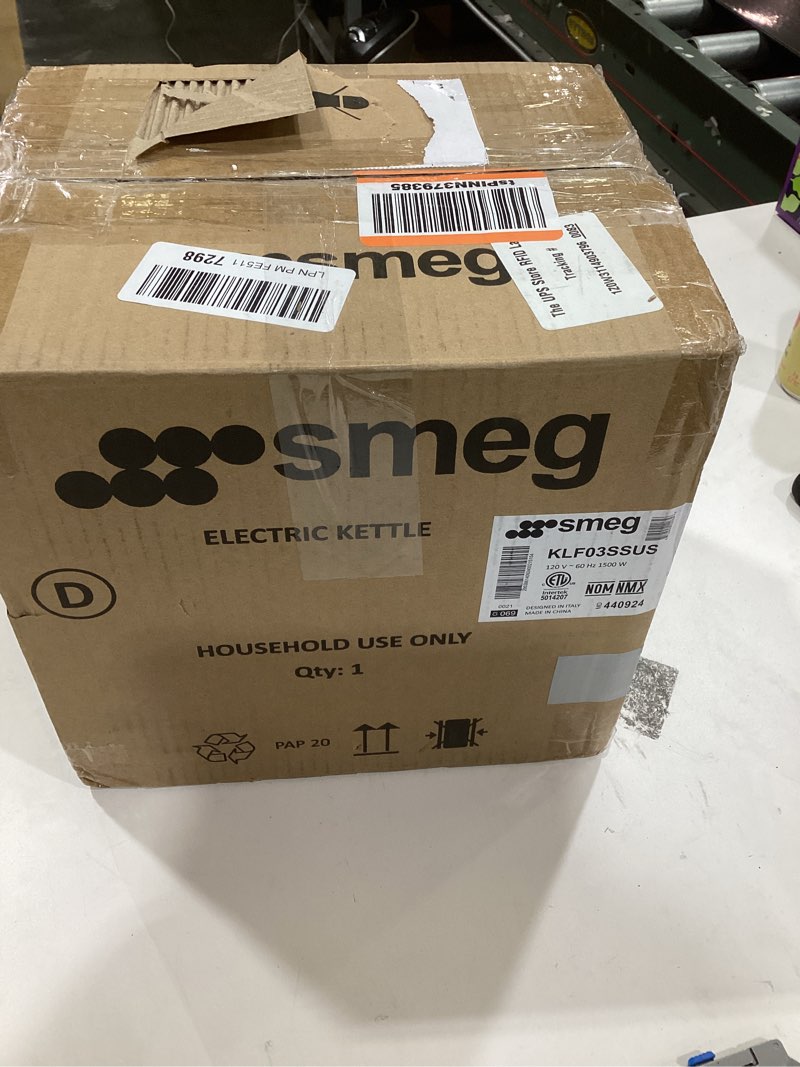 Condition photo showing As Is for SMEG 50's Retro Style Electric Water Kettle with Automatic Shutoff, Removable Base, and Water Indicator, KLF03SSUS, Polished Stainless Steel