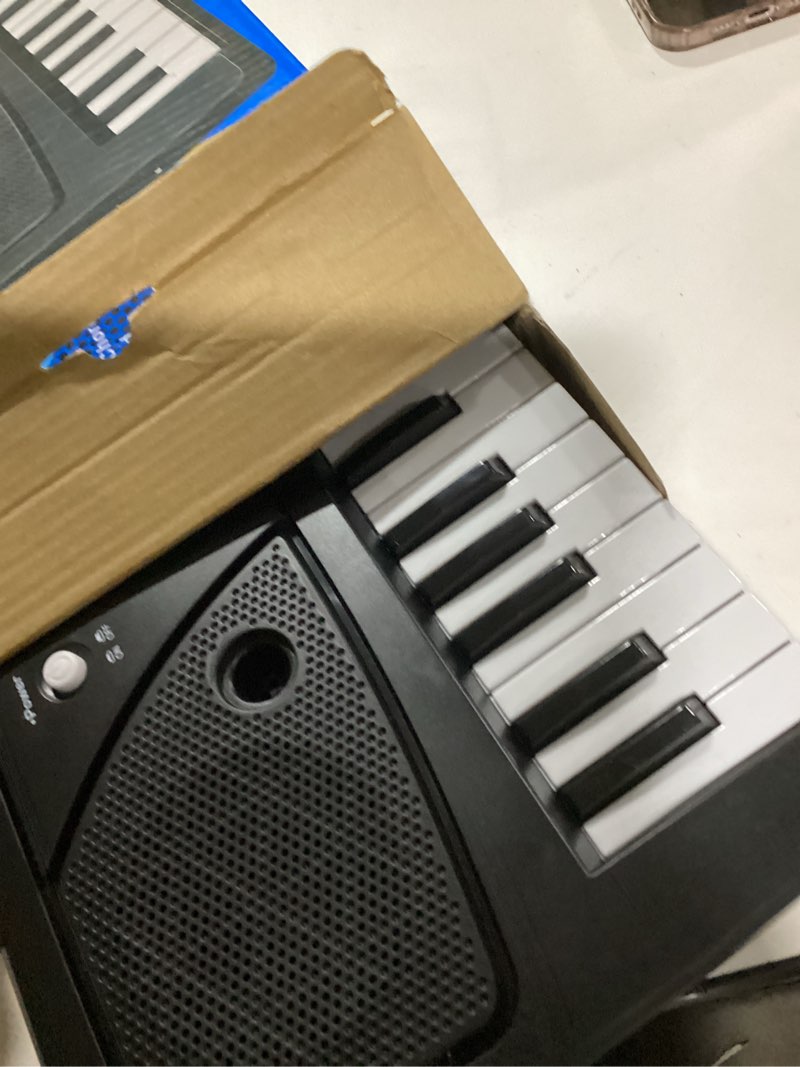 Condition photo showing Good Condition for Raimy Piano Keyboard for Beginners, 61 Keys Portable Electronic Digital Piano with Microphone, Learning Educational Music Keyboard Piano for Kids Gifts Toys for Boys Girls Toddlers (Black)