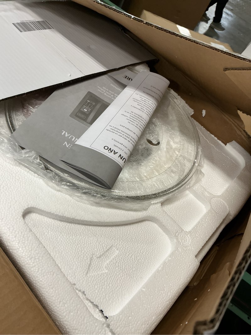 Condition photo showing Good Condition for Farberware 1.1 Cu. Ft. Countertop Microwave Oven – 1000 Watts Power, Auto Cook Settings, Defrost, Easy Clean and Child Safety Lock - Stainless and Black 1.1 Cu. Ft. Black Stainless