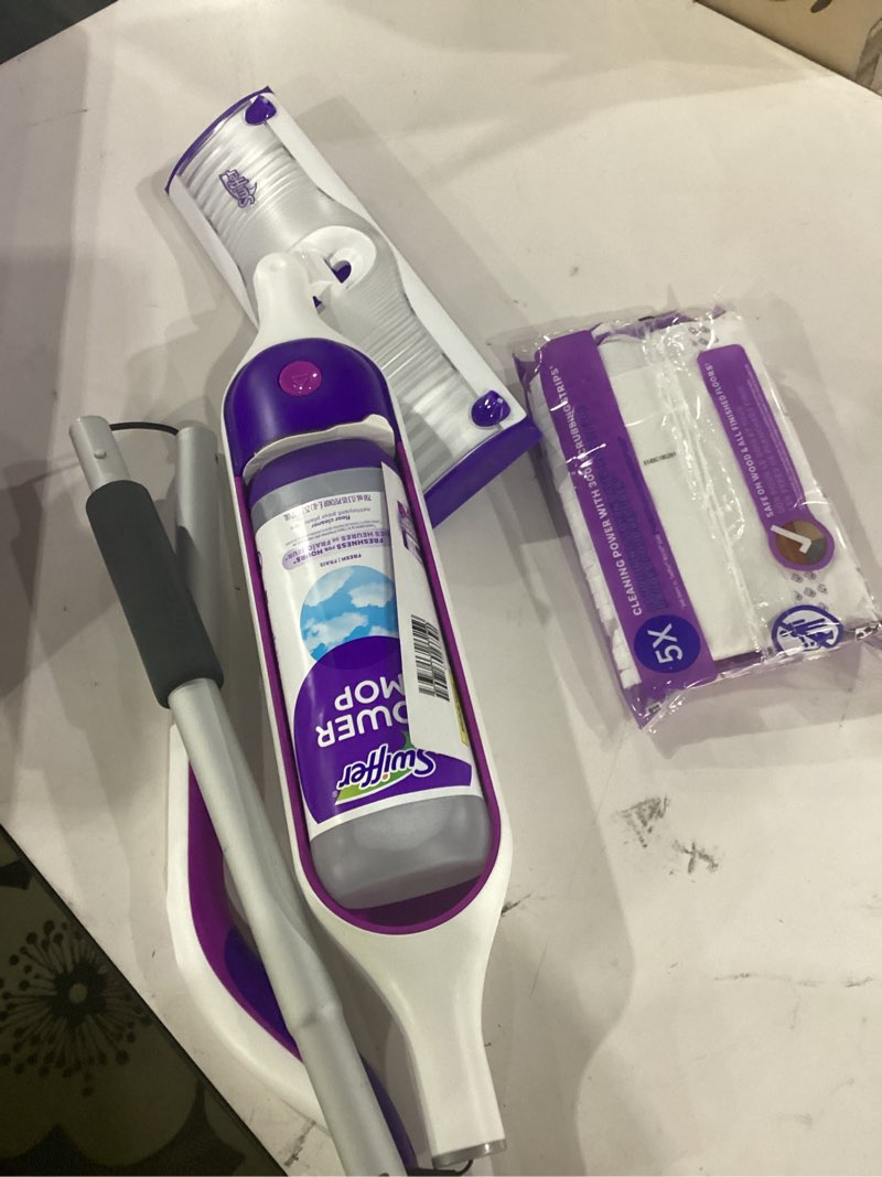 Condition photo showing New/Like New for swiffer powermop multi-surface mop kit for floor cleaning, fresh scent, mopping kit includes powermop, 2 mopping pad refills, 1 floor cleaning solution with fresh scent and 2 batteries purple and white