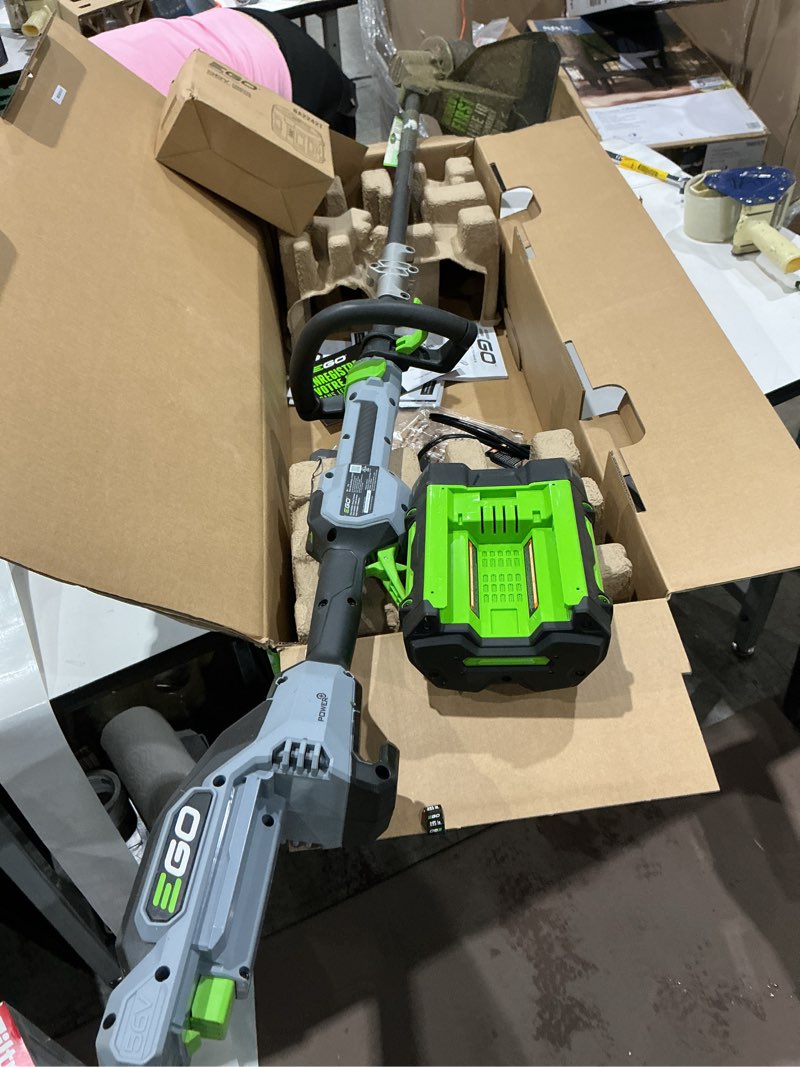 Condition photo showing As Is for ego power+ line iq with powerload st1623t 16 in. 56 v battery string trimmer kit (battery & charger) w/ telescopic shaft & 4.0 ah battery