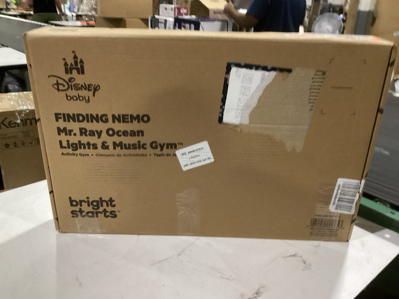 Condition photo showing New/Like New for bright starts disney baby finding nemo mr. ray ocean lights & music gym, ages newborn +