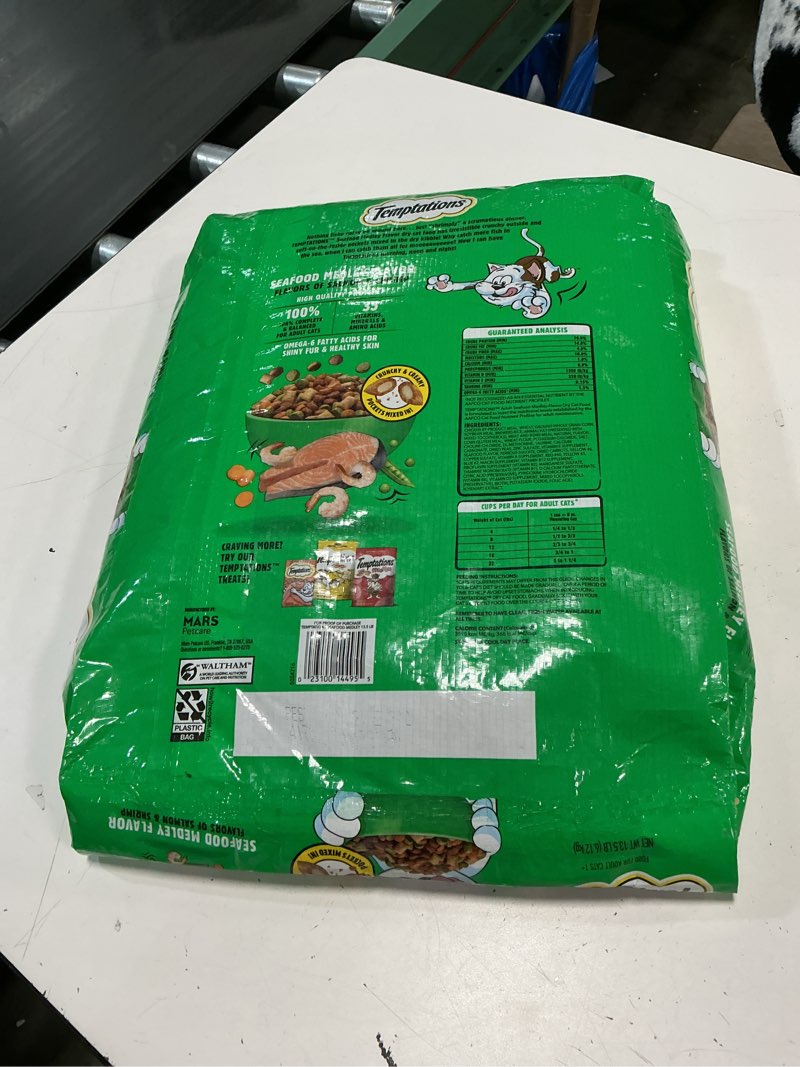 Condition photo showing New/Like New for (unknown best by date ) temptations seafood medley flavor adult dry cat food, 13.5 lb. bag
