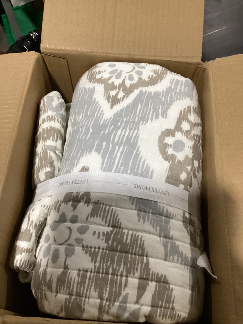 Condition photo showing Good Condition for levtex home - becker taupe quilt set - king quilt and two king shams - ikat - taupe, grey and cream - quilt (106x92in.) and shams (20x36in.) - reversible - cotton quilt - king/cal king taupe