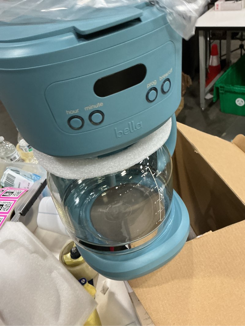 Condition photo showing New/Like New for bella 12 cup programmable coffee marker, reusable dishwasher safe accessories, easy lcd diaply, auto shutoff, 900 watt, surf