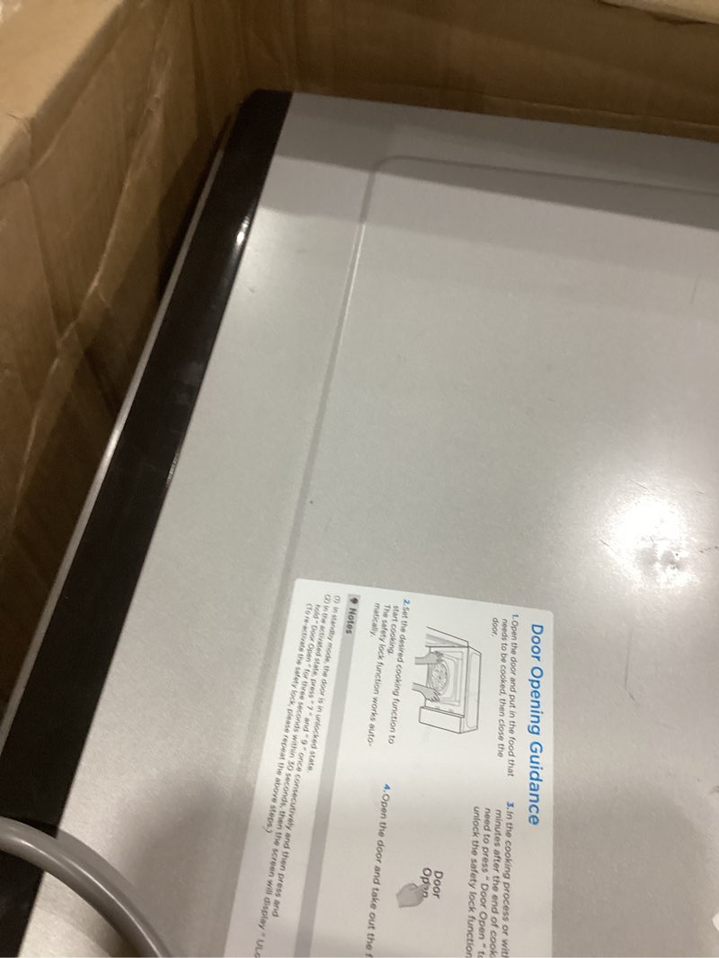 Condition photo showing As Is for Farberware 1.6 Cu. Ft. Countertop Microwave Oven – 1100 Watts Power, Smart Sensor Auto Cook Settings, Defrost, Easy Clean and Child Safety Lock - Stainless 1.6 Cu. Ft. Stainless Steel