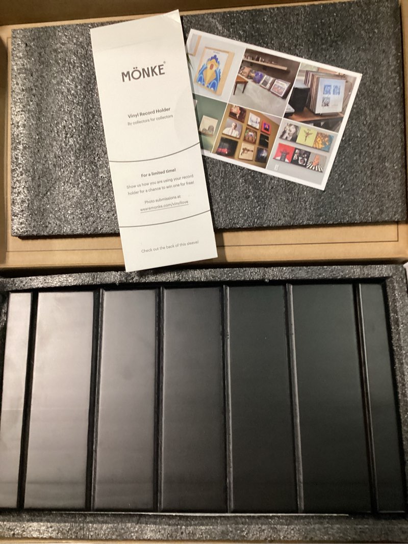 Condition photo showing New/Like New for premium vinyl record rack - a mid-century style record holder for albums, 60-70 lp capacity - complements any record player (black) black 60-70 lp