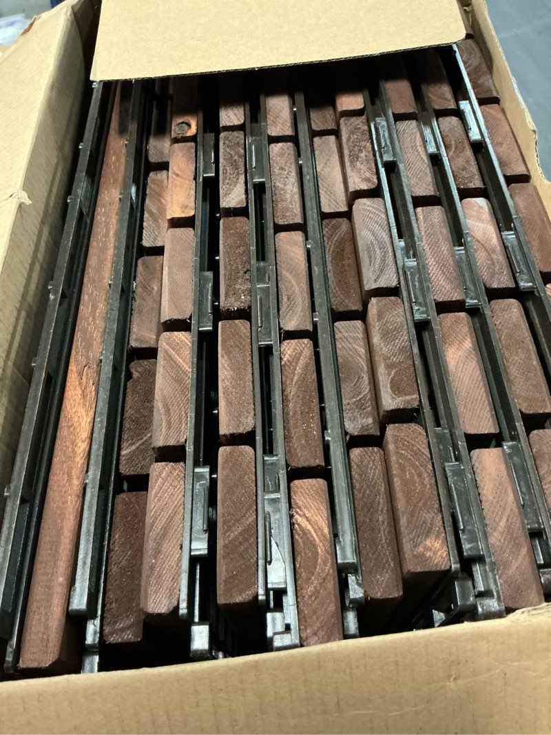 Condition photo showing Good Condition for thyoi 10pcs 12"x12" acacia deck tiles, interlocking, water resistant, indoor/outdoor (square joint, stripe pattern, 6 slats, dark brown)