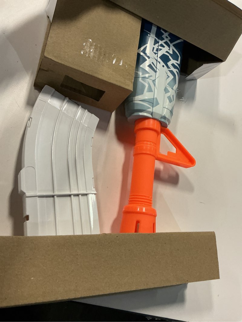 Condition photo showing Good Condition for nerf fortnite blue shock blaster, 10-dart clip, 10 elite nerf darts, includes bonus code to unlock the beat wrap in the game, motorized dart blaster