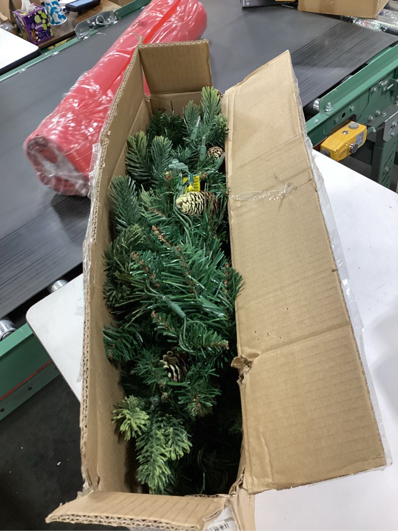 Condition photo showing New/Like New for National Tree Company 9 ft Pre-Lit Carolina Pine Artificial Christmas Garland, Christmas Decoration with Pinecones, 100 Clear Lights, 240 Tips, Green 100 Lights Tree