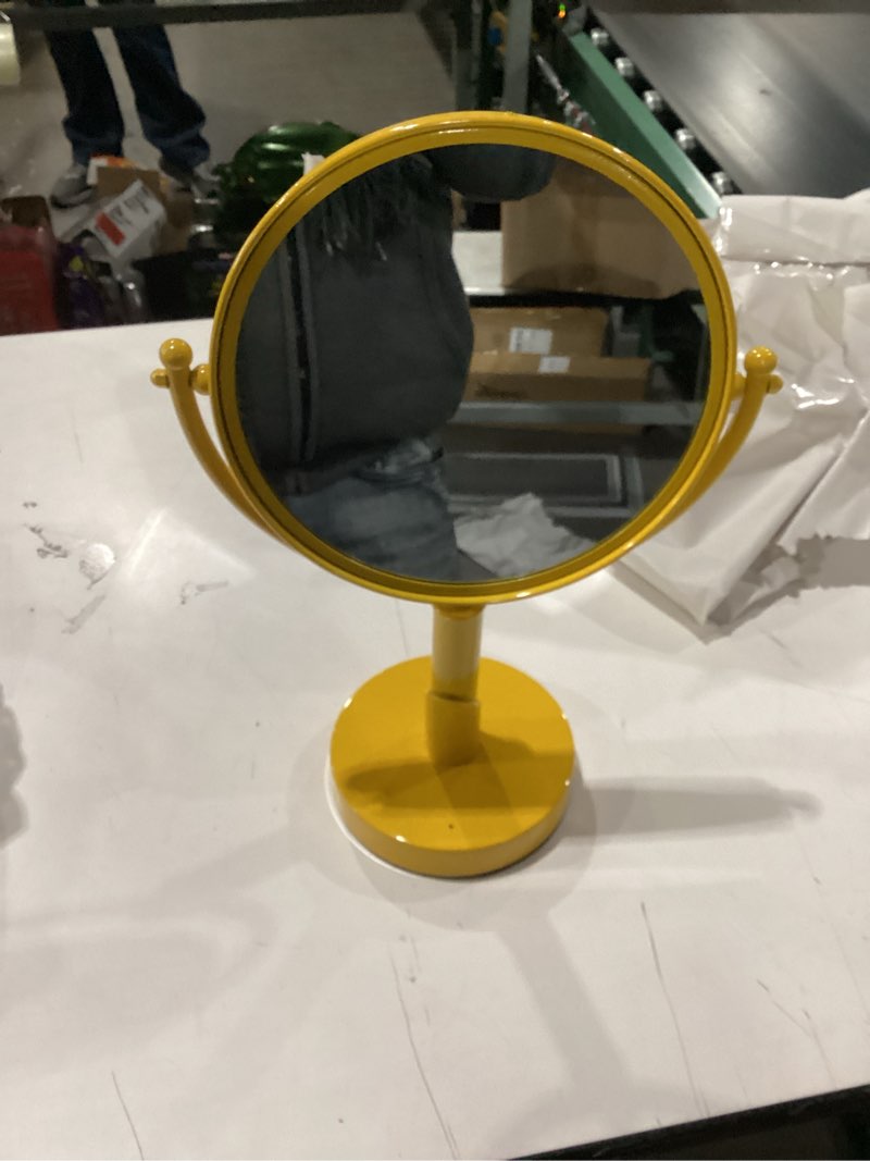 Condition photo showing As Is for yellow Mid-Century Modern rotating double-sided magnifying parlor mirror from the 1960s or 1970s. 
