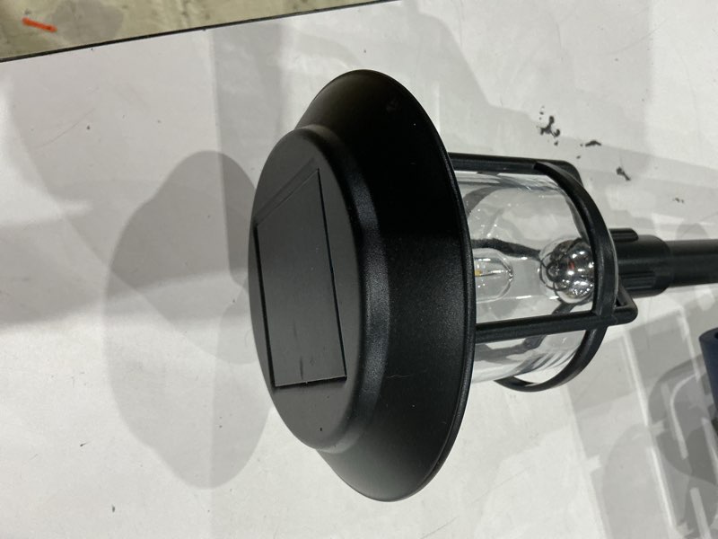 Condition photo showing As Is for harbor breeze 15 -lumens black solar led outdoor path light with dusk-to-dawn sensor