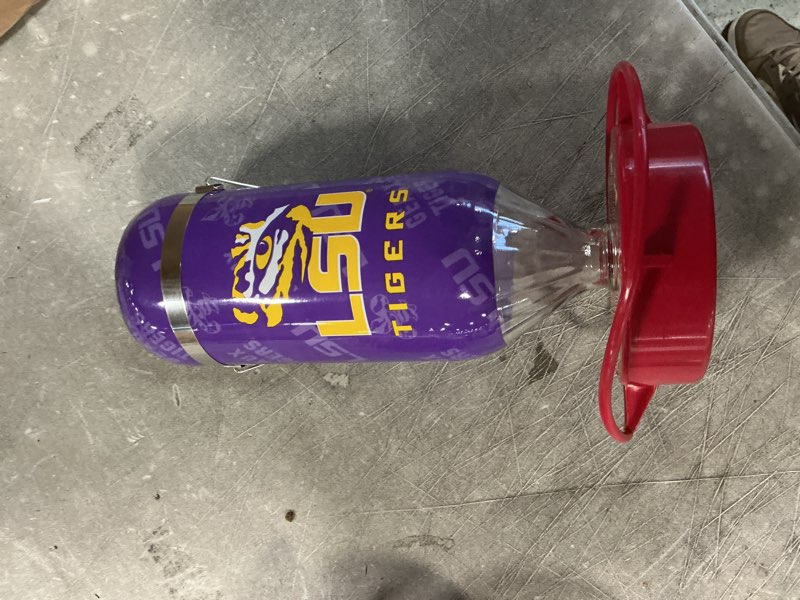 Condition photo showing Good Condition for Hummer's Galore, NCAA College Football Hummingbird Feeder, Glass Hummingbird Feeder with UV Resistant Plastic Wrap for Outdoors Hanging, 32 oz, (LSU)