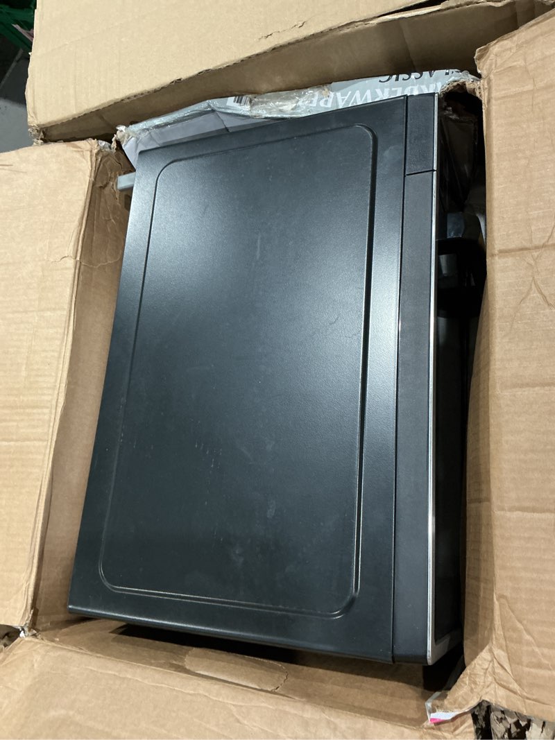 Condition photo showing As Is for farberware 0.9 cu. ft. countertop microwave oven – 900 watts power, auto cook settings, defrost, easy clean and child safety lock - stainless 0.9 cu. ft. stainless