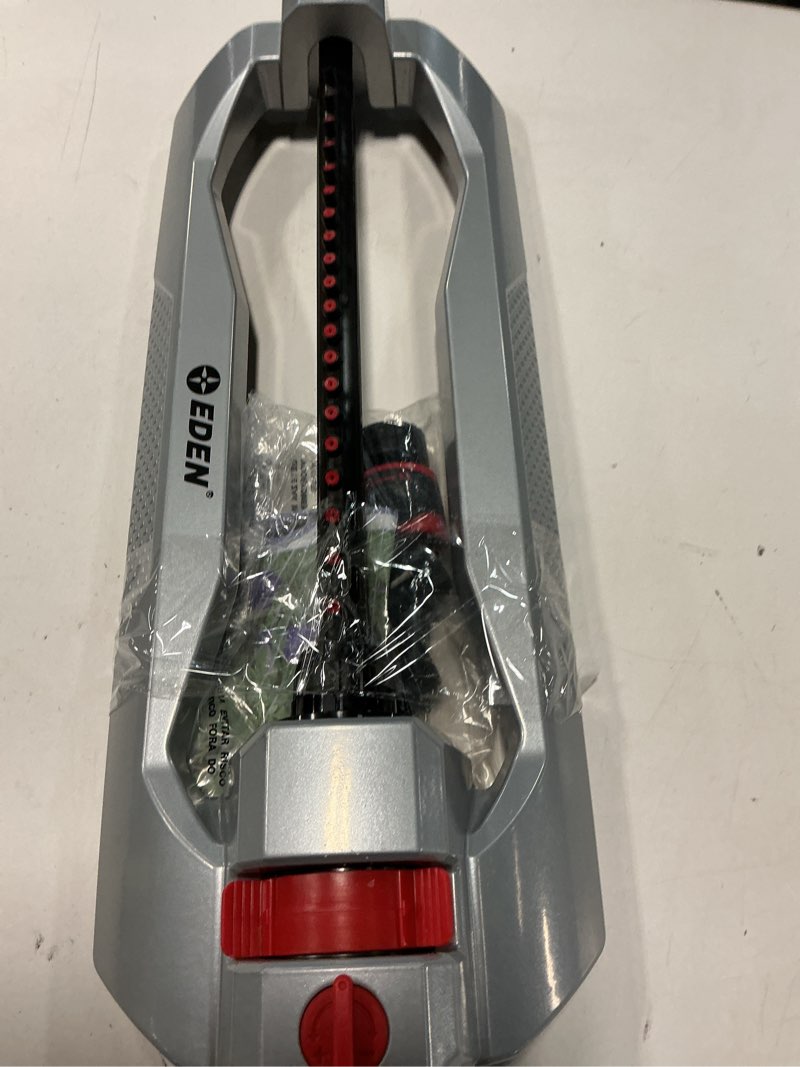 Condition photo showing As Is for Eden 94111 Heavy Duty Metal Oscillating Sprinkler, Covers Up to 3,328 sq. ft., 20 Precision Nozzles, Flow Control, Adjustable Range, Quick Connect Bundle, Silver, Red, Black 20 Nozzles Metal with Flow and Range Control