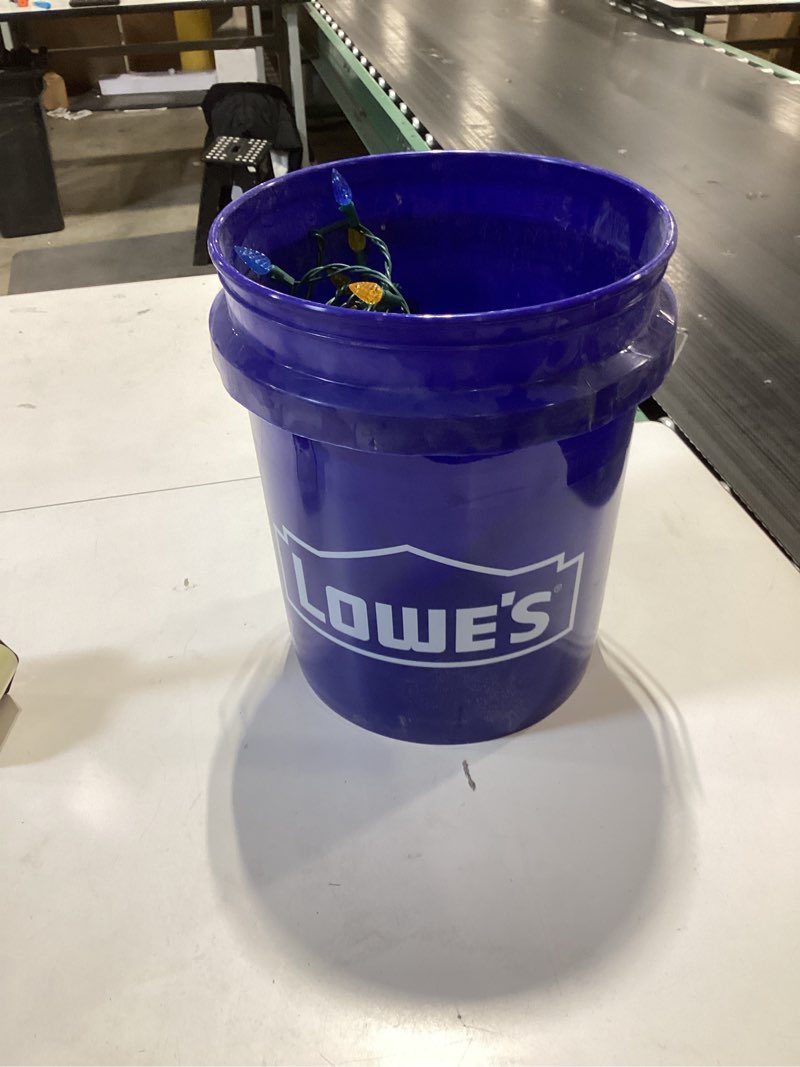 Condition photo showing As Is for Lowe’s bucket with miscellaneous lights 